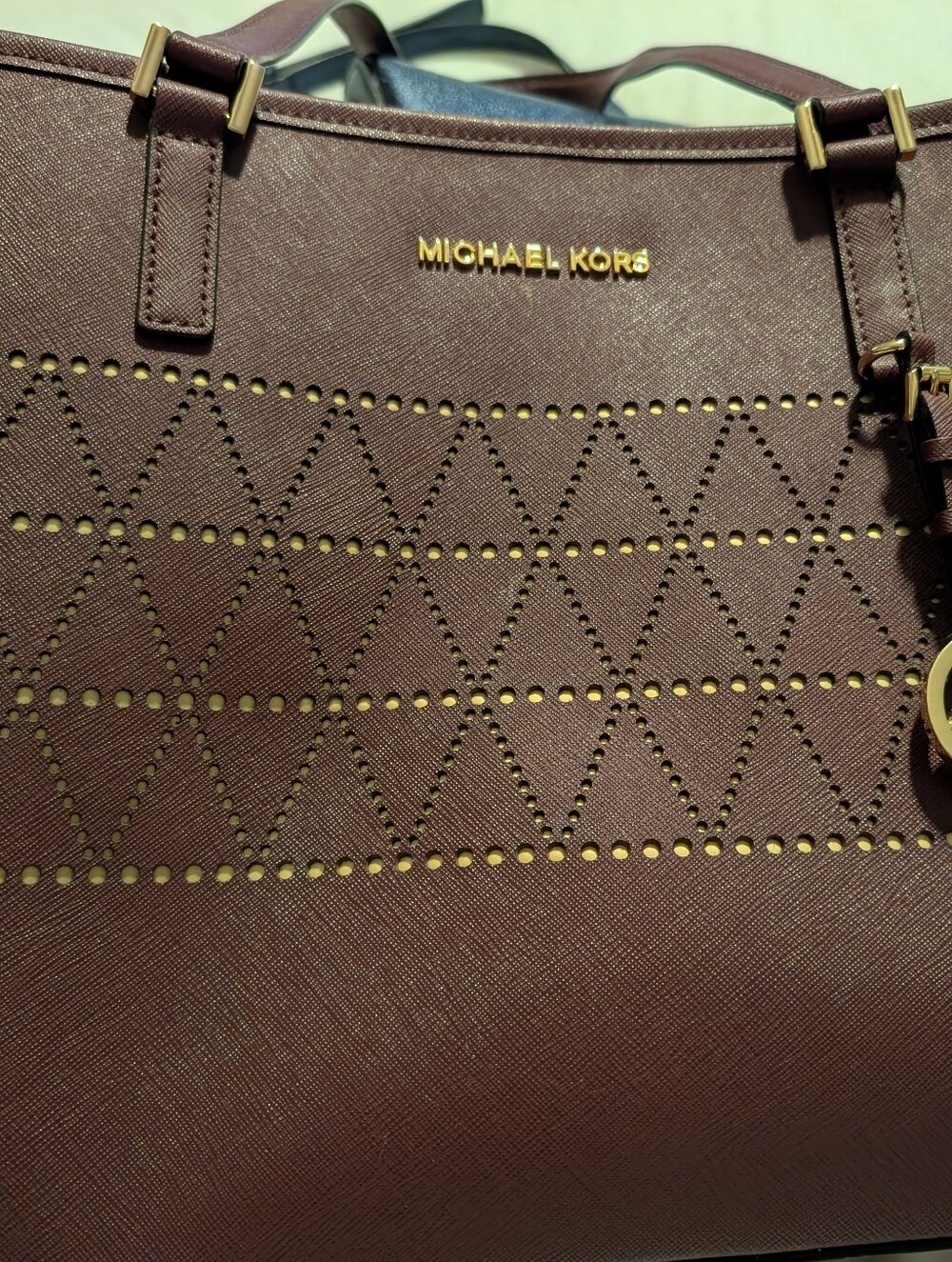 Michael Kors Burgundy Perforated Saffiano Tote with Gold Hardware